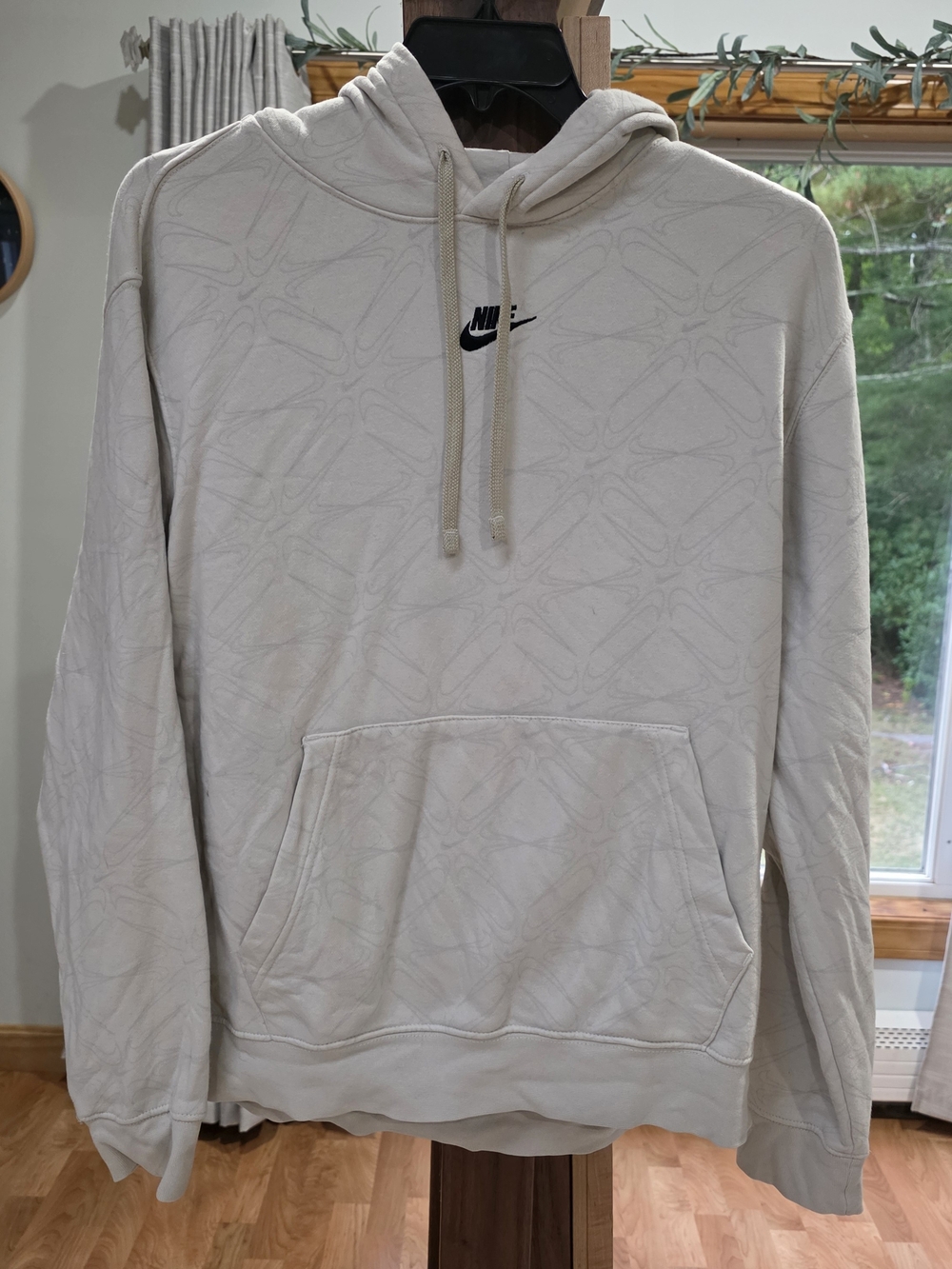 Nike Men's Light Cream Hoodie with Subtle Pattern and Black Logo